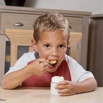 Child eating an egg